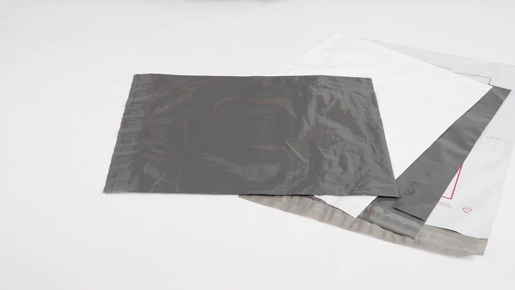Grey and white courier flyer bags with self-seal strips